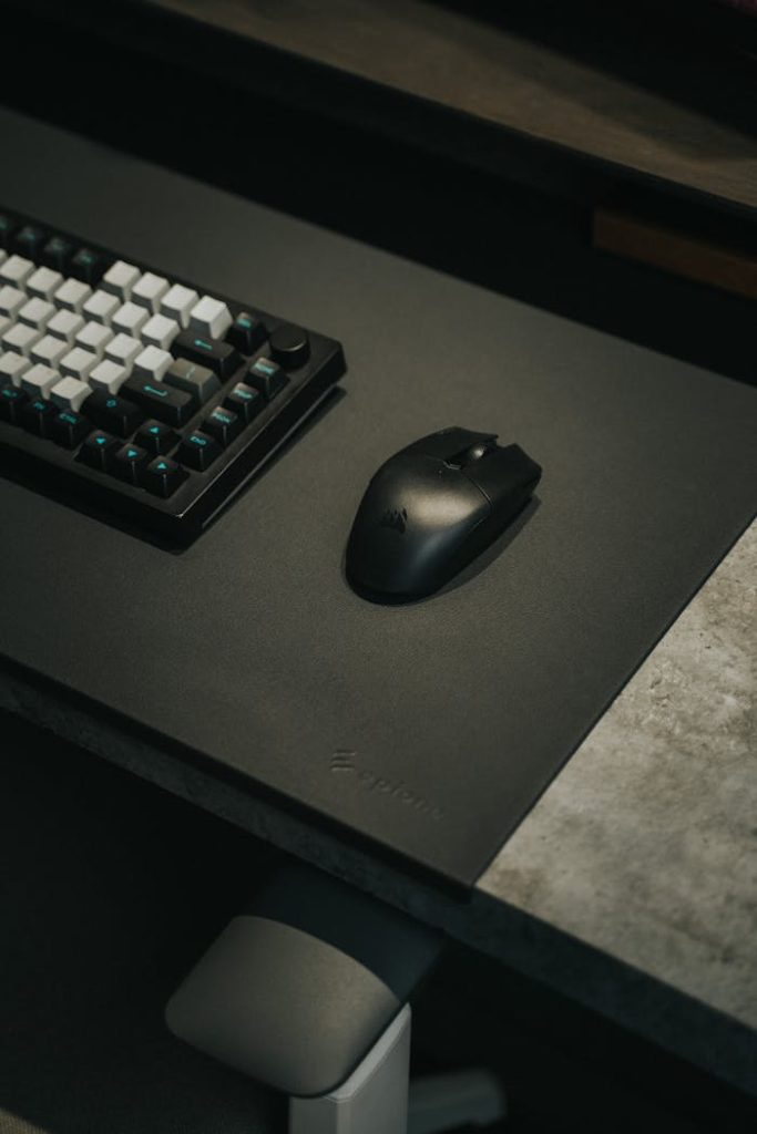 pexels-photo-20213726 A sleek gaming setup featuring a mechanical keyboard and wireless mouse on a stylish desk.